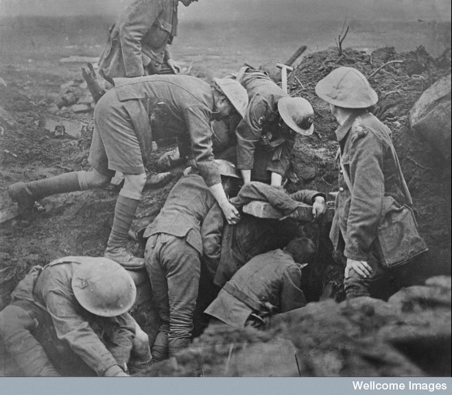 Digging out wounded from a First-Aid shelter which had been blown up by a shell